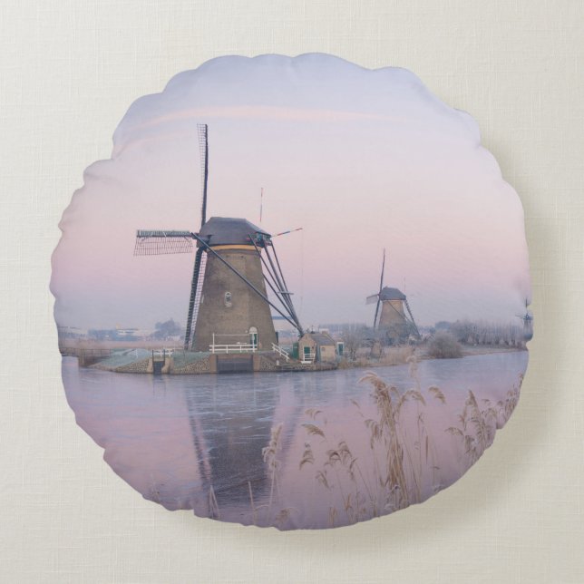Soft sunrise light in winter over windmills round pillow (Front)