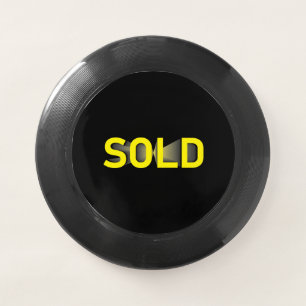 sold sign yellow black Wham-O frisbee
