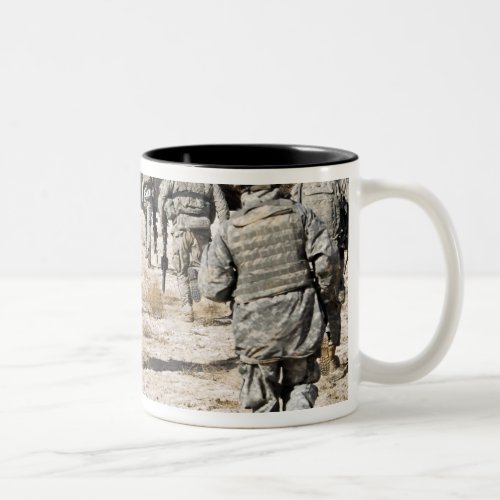 soldiers respond to a small arms attack Two_Tone coffee mug