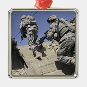 Soldiers running up staircase of a building metal ornament