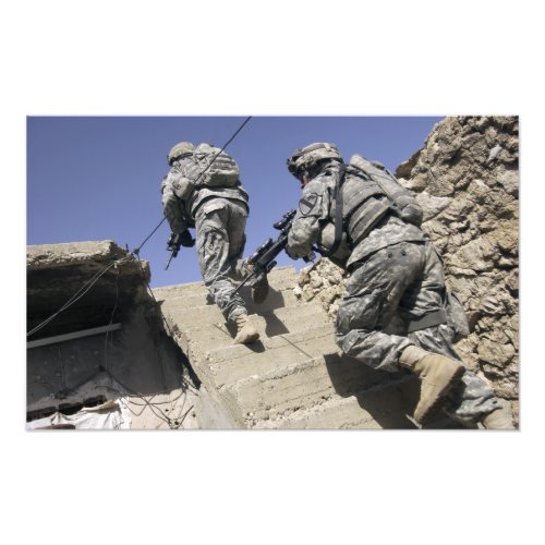 Soldiers running up staircase of a building photo print