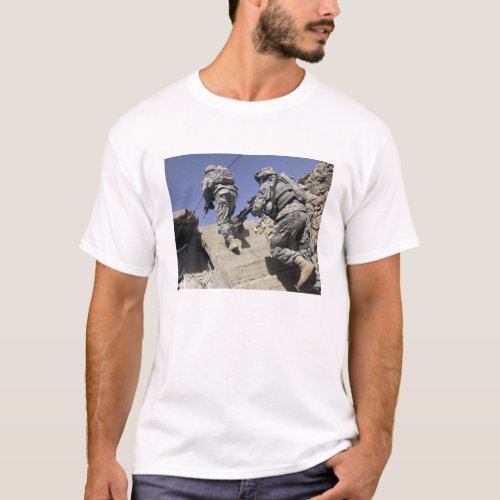 Soldiers running up staircase of a building T_Shirt