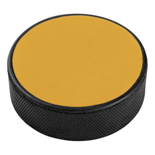 Solid amber dirty yellow hockey puck