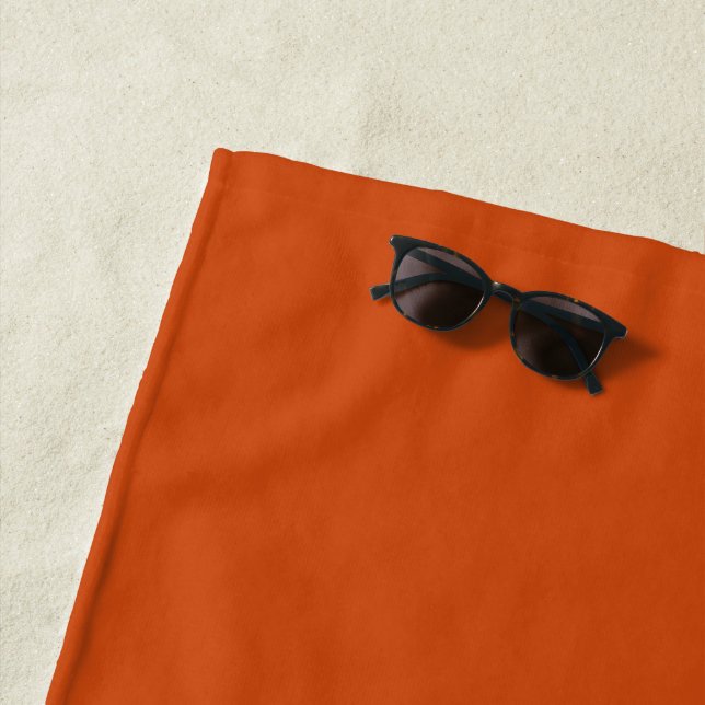 Solid color plain rusty burnt orange beach towel (In Situ)