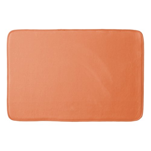 Solid coral orange bath mat