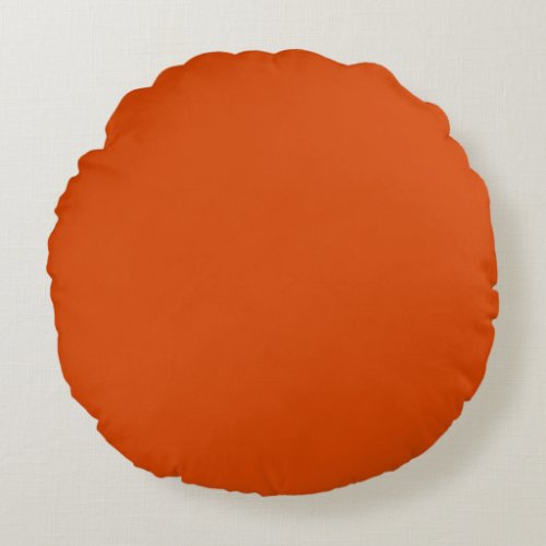Solid dark burnt orange round pillow