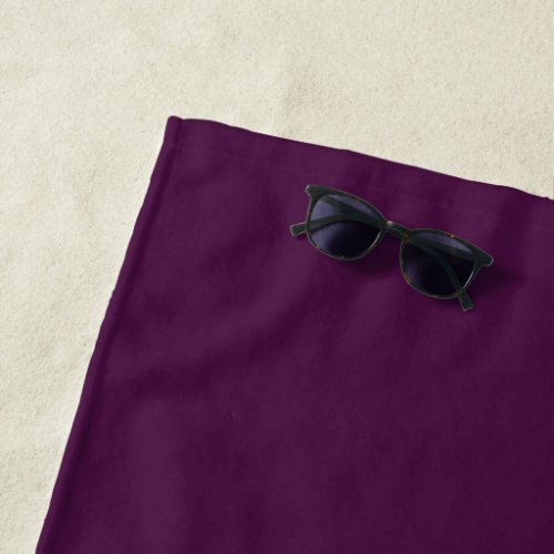 Solid dark plum purple beach towel