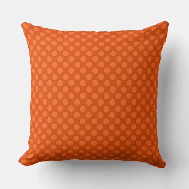 Solid orange polka dots on an orange background throw pillow (Front)