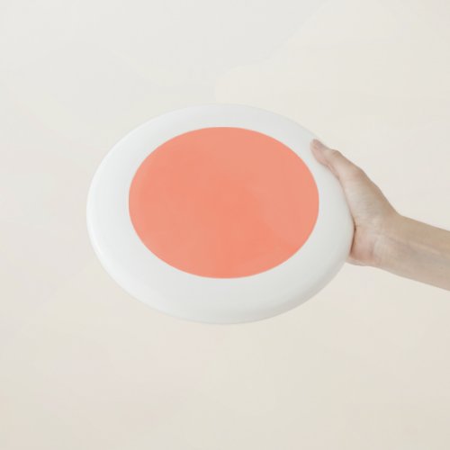 Solid peach Wham_O frisbee