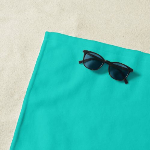 Solid plain bright turquoise beach towel