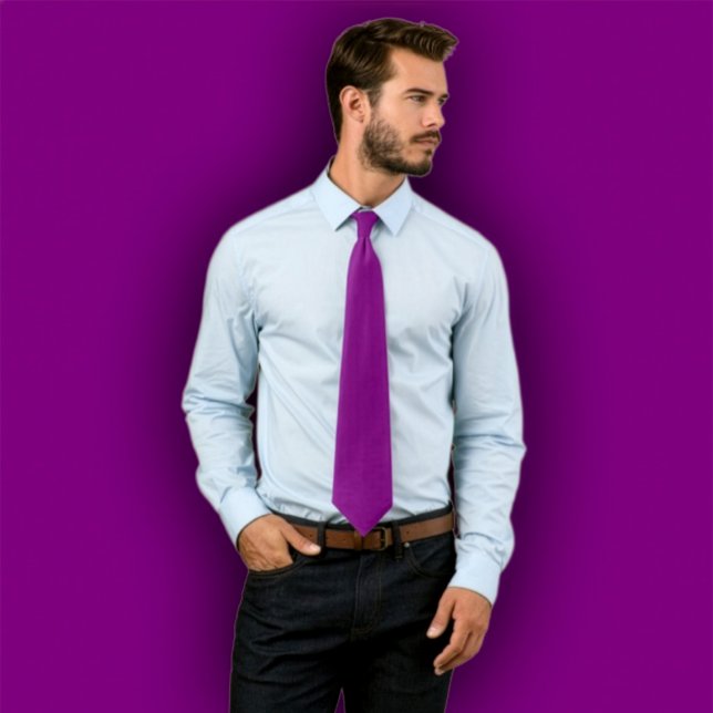 Solid  Purple Tie -  Single Color Necktie (Man wearing a solid purple necktie, standing against a purple background that matches the tie.
)
