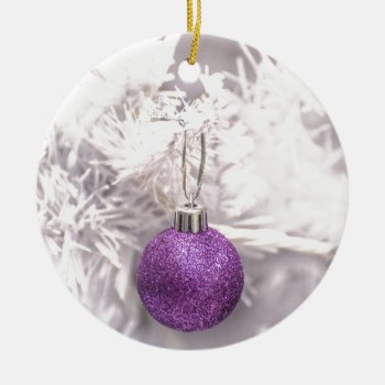 Solitary Purple Christmas Ball Ceramic Ornament by FunWithFibro at Zazzle