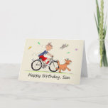 Son Birthday Cartoon of a Boy Riding Bike Card<br><div class="desc">This is an amusing card for someone to give their son on their birthday. It is a cartoon caricature of a boy on his bike following behind a smiling brown dog strutting along, surrounded by butterflies, and a bird. The young boy is wearing red shorts and socks, a blue t...</div>