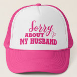 Sorry About My Husband Funny Trucker Hat<br><div class="desc">This trucker hat is perfect for any wife who's had a rough day with their husband! The humorous phrase "Sorry About My Husband" is a relatable and lighthearted way to poke fun at the frustrations that come with married life. Whether you're having a good laugh with your friends or just...</div>