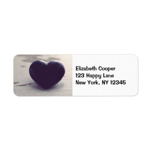 Soulful Purple Stone Heart on a Sandy Beach Label