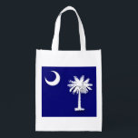 South Carolina's Flag Reuseable Bag<br><div class="desc">The crescent moon and Palmetto palm - South Carolina's iconic symbol! This bag is amazing! It is perfect for gifts, for groceries, for books, for the beach and it is so inexpensive but so practical!</div>