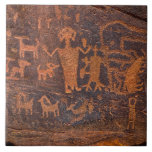Southwest Petroglyph Ceramic Tile<br><div class="desc">Southwest Petroglyph Ceramic Tile is a rock painting that displays art from Native American cultures. Petroglyphs (also called rock engravings) are pictogram and logogram images created by removing part of a rock surface by incising, picking, carving, and abrading. Outside North America, scholars often use terms such as "carving", "engraving", or...</div>