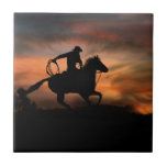 Southwestern Cowboy and Horse In the Sunset Ceramic Tile<br><div class="desc">Stunning image of a cowboy and his horse in a southwestern sunset.  He is running at full speed with his lariat out.  This is a beautiful country western art tile.  Looks great framed or in a wood box.</div>