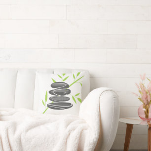 Spa pillow with stacked pebble stones and bamboo