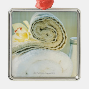 Spa towels and tropical flower metal ornament