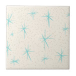 Space Age Turquoise Starbursts Ceramic Tile<br><div class="desc">This Space Age Turquoise Starbursts Small Ceramic Tile features blue starbursts on a creamy background with gold colored speckles. Inspired by a classic mid century modern dish pattern, this design has an authentic vintage flair. The retro kitschy goodness will make you feel like you’ve stumbled across a flea market treasure....</div>
