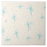 Space Age Turquoise Starbursts Ceramic Tile<br><div class="desc">This Space Age Turquoise Starbursts Large Ceramic Tile features blue starbursts on a creamy background with gold colored speckles. Inspired by a classic mid century modern dish pattern, this design has an authentic vintage flair. The retro kitschy goodness will make you feel like you’ve stumbled across a flea market treasure....</div>