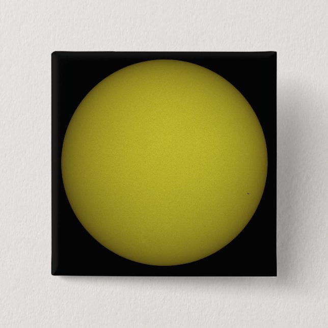 Space Shuttle Atlantis is seen in silhouette Button (Front)