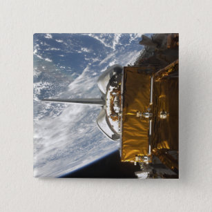 Space Shuttle Atlantis' payload bay backdropped Button