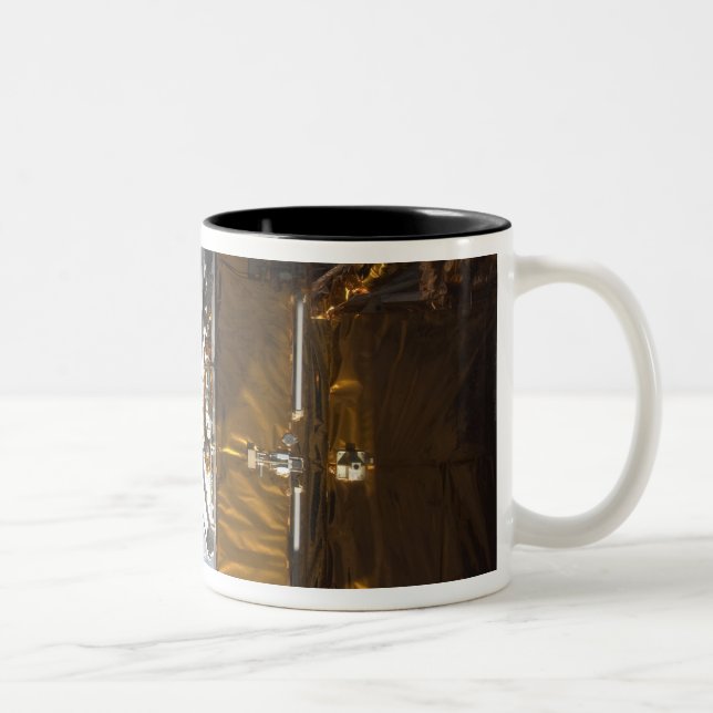 Space Shuttle Atlantis' payload bay backdropped Two-Tone Coffee Mug (Right)