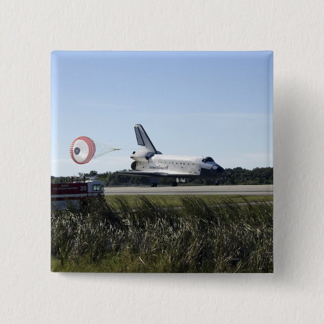 Space shuttle Atlantis unfurls its drag chute Button (Front)
