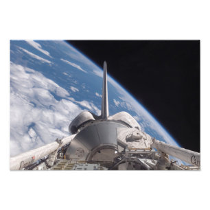 Space Shuttle Discovery backdropped by Earth Photo Print