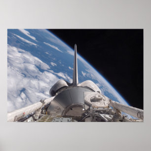 Space Shuttle Discovery backdropped by Earth Poster