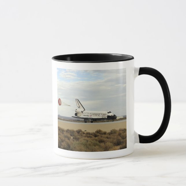 Space Shuttle Discovery deploys its drag chute Mug (Right)