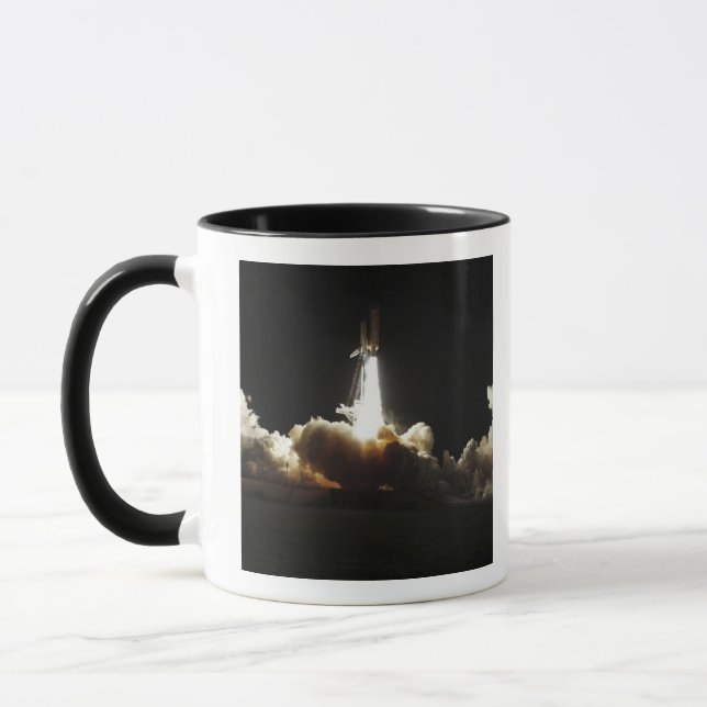 Space shuttle Discovery lifts off Mug (Left)