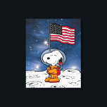 SPACE | Snoopy With Flag Astronaut Canvas Print<br><div class="desc">This Peanuts artwork celebrates the 50th Anniversary of the 1969 Apollo 10 orbit of the moon and the Apollo 11 moon landing. This design features Snoopy in his orange space suit flying the American flag.</div>