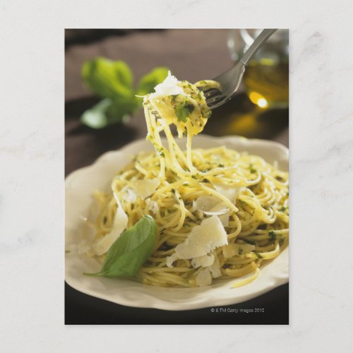 Spaghetti with basil and parmesan on plate postcard
