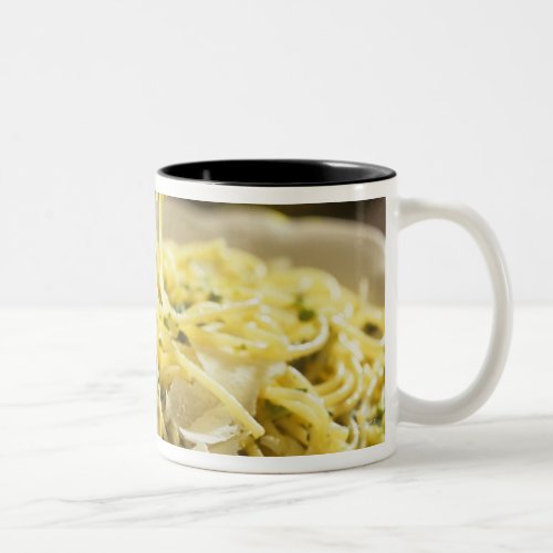 Spaghetti with basil and parmesan on plate Two_Tone coffee mug