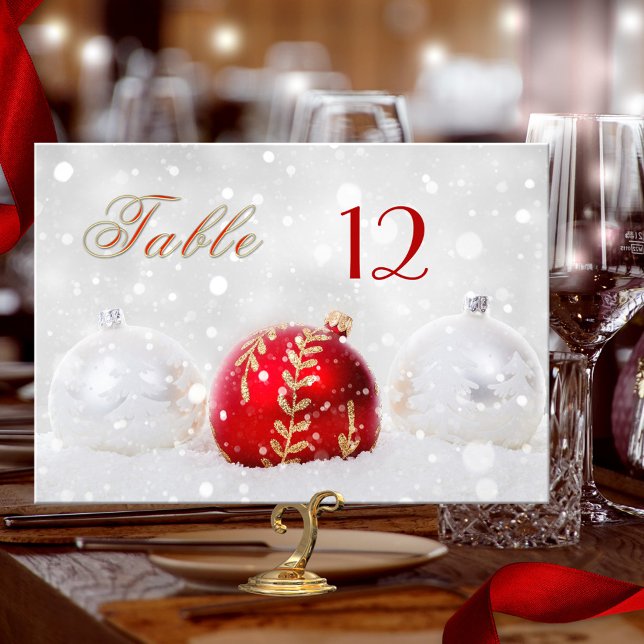 Sparkly Snow Christmas Baubles Table Number Card (Table number card showing festive Christmas balls with sparkling snow, in silver white, gold and red)