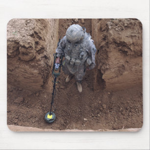 Specialist searches for a weapons cache mouse pad