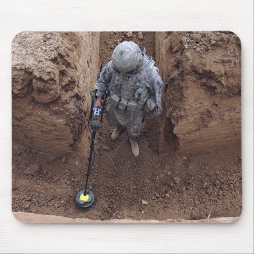 Specialist searches for a weapons cache mouse pad