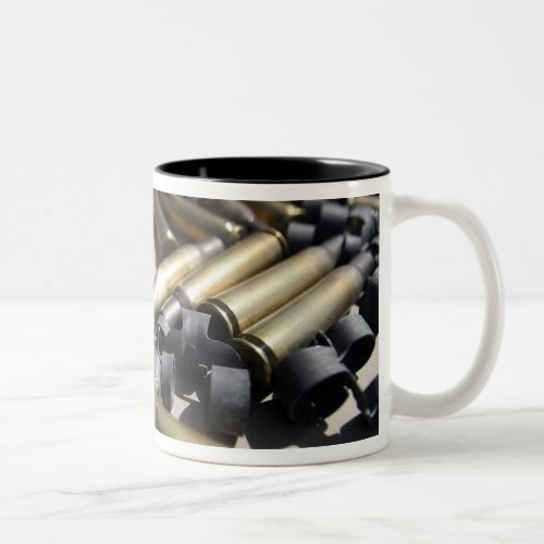Spent brass and disintegrated links Two_Tone coffee mug