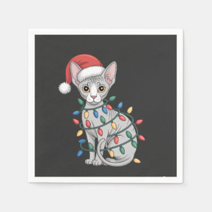 Sphynx Cat Wearing a Santa Hat and Wrapped in Xmas Napkins
