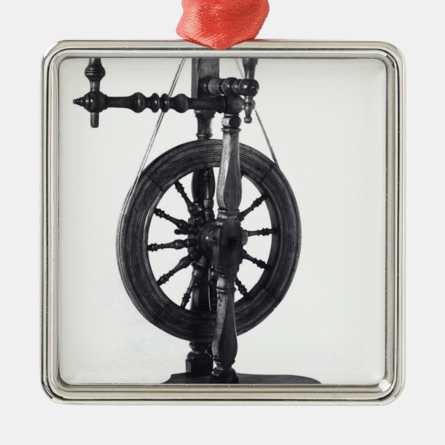 Spinning wheel metal ornament (Front)