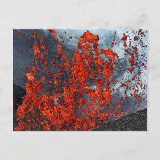 Splash of hot lava from crater of erupting volcano postcard
