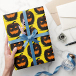 Spooky Black Pumpkins Halloween Pattern On Yellow Wrapping Paper<br><div class="desc">Trendy wrapping paper featuring aHalloween pattern with spooky black pumpkins on a bright yellow background.
It's a lovely idea for wrapping a gift for a  trick or treat party or another autumn thematic party or festive occasion.</div>