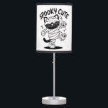 Spooky Cute Cat Halloween Design Table Lamp<br><div class="desc">Add a touch of spooky charm with this Spooky Cute Cat design! Featuring an adorable black cat wrapped like a mummy,  it’s perfect for Halloween lovers who enjoy cute and creepy vibes. Great for t-shirts,  hoodies,  stickers,  and gifts. Ideal for cat lovers,  kawaii fans,  and spooky season vibes.</div>