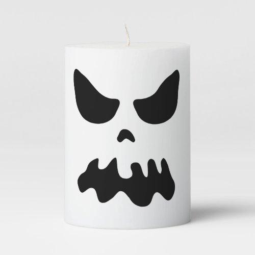 Spooky Halloween candles with scary ghost face