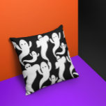 Spooky Halloween Ghosts Throw Pillow<br><div class="desc">This fun throw pillow features spooky yet whimsical Halloween ghosts flying into a black sky.</div>