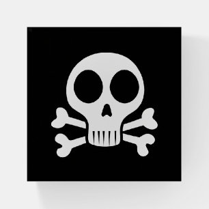 spooky skull on a black background paperweight