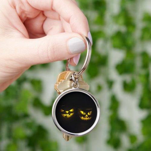 Spooky yellow on black eerie pumpkin face design keychain